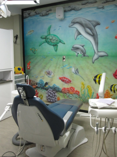 Air brush painting of dolphin in kid's operatory